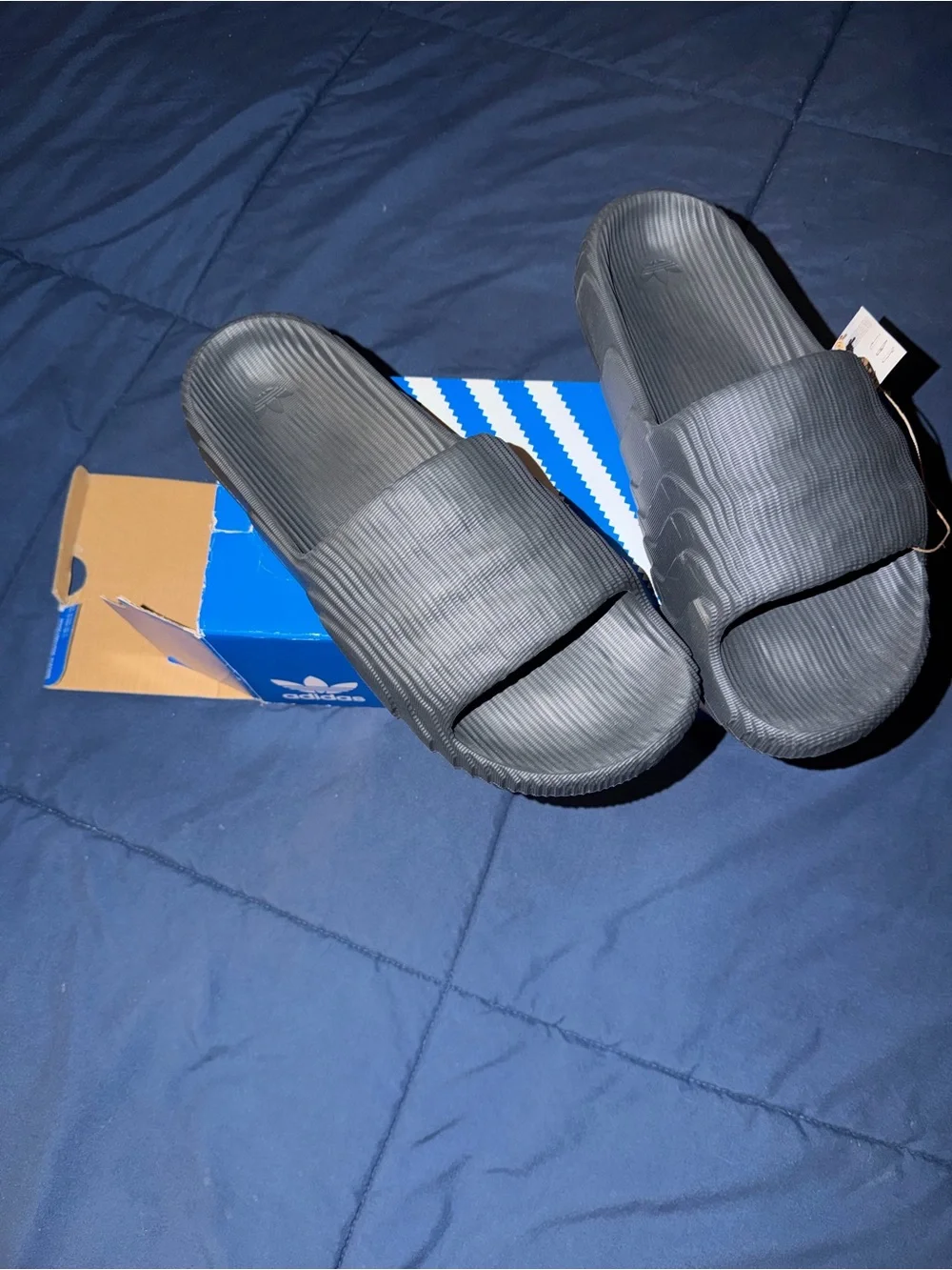 Adidas Adilette 22 Carbon Slides with a distinct 3D topographic texture